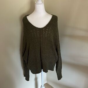 Knitted green v neck sweater